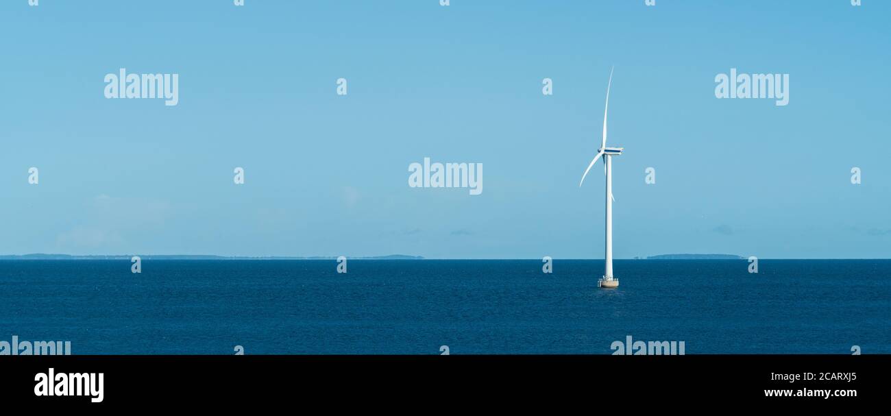Wind turbine at sea shore Stock Photo