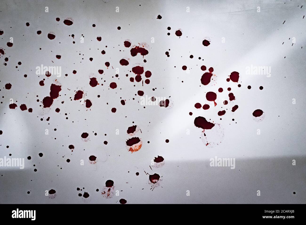 red blood drops on a white background coloring splattered depression self harm texture Stock Photo