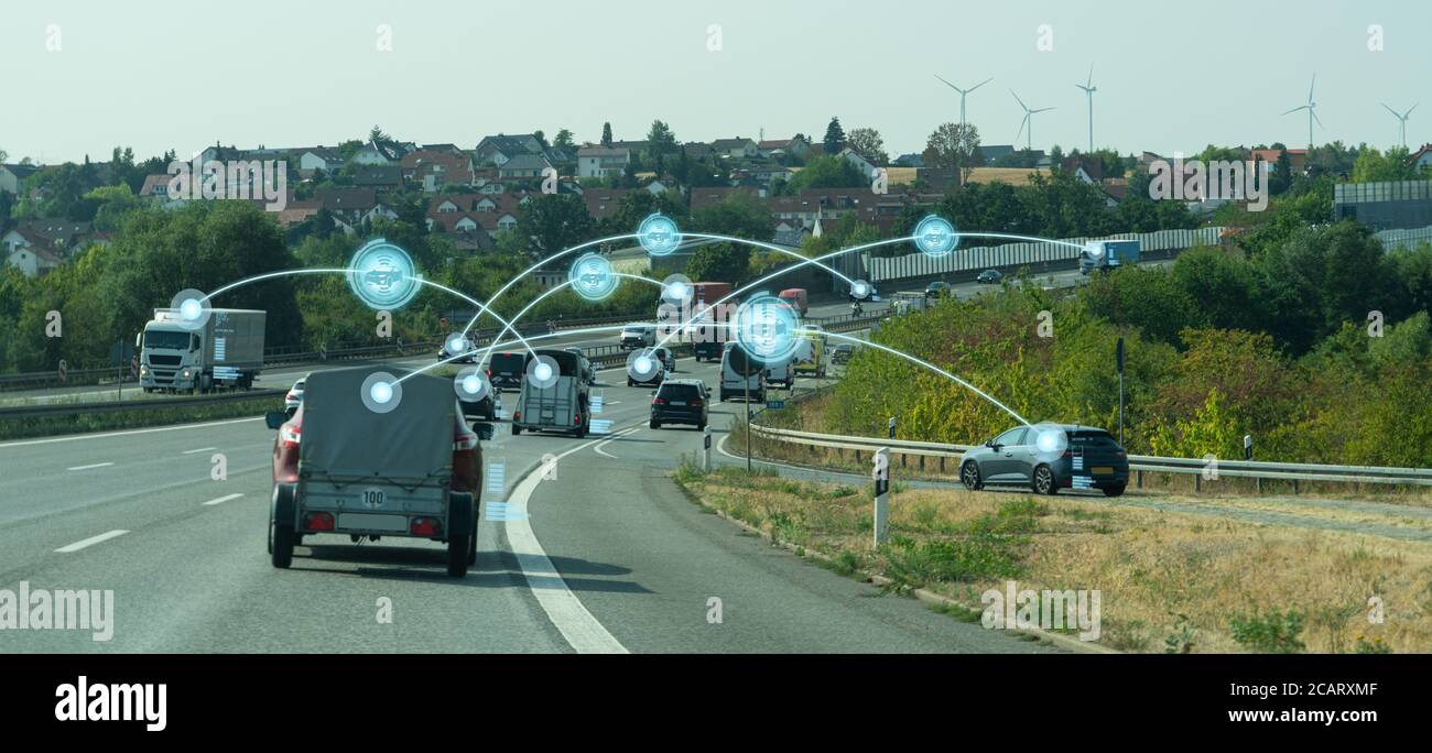 Vehicle to vehicle communication. Data exchange between cars. Stock Photo