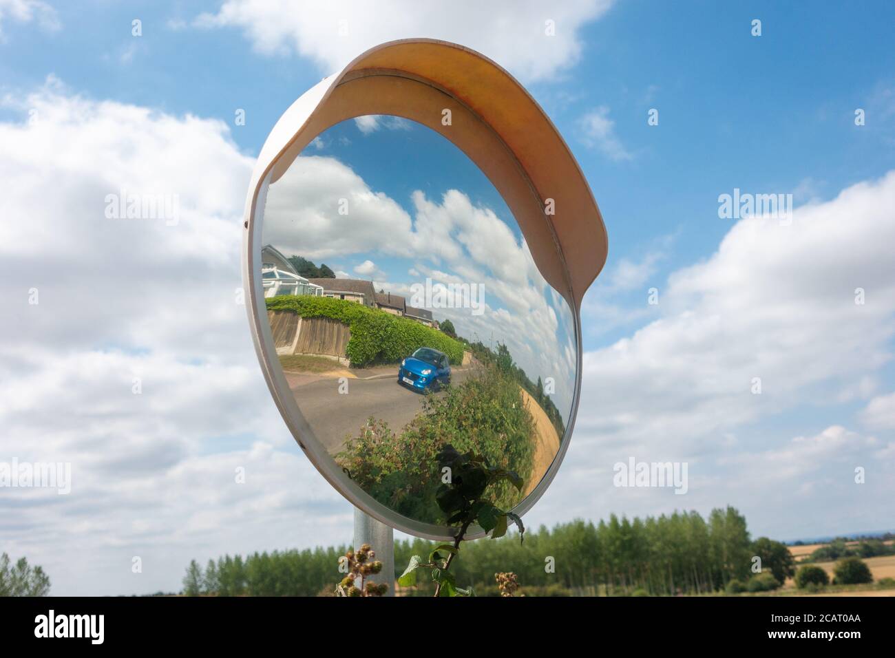 Driveway convex circular mirror. Helps improve visibility around blind spots and corners Stock