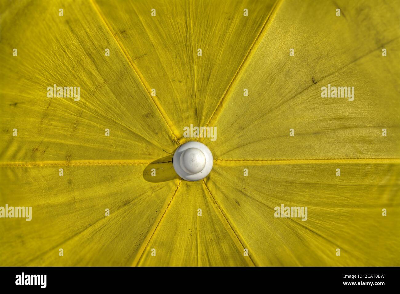 yellow parasol seen from above in hdr tone mapping effect Stock Photo