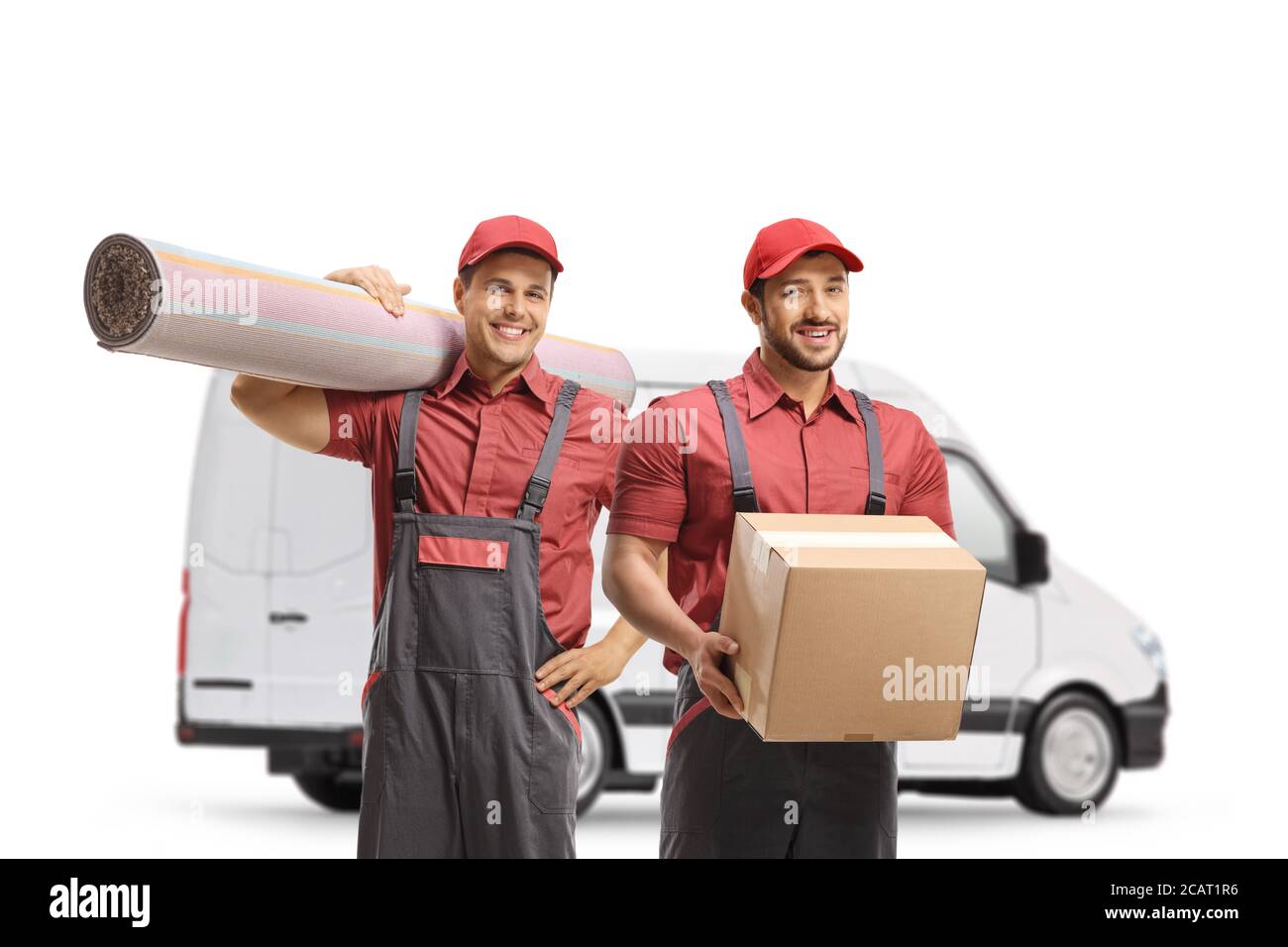 Workers from a moving company with a box and carpet in front of a white van isolated on white background Stock Photo