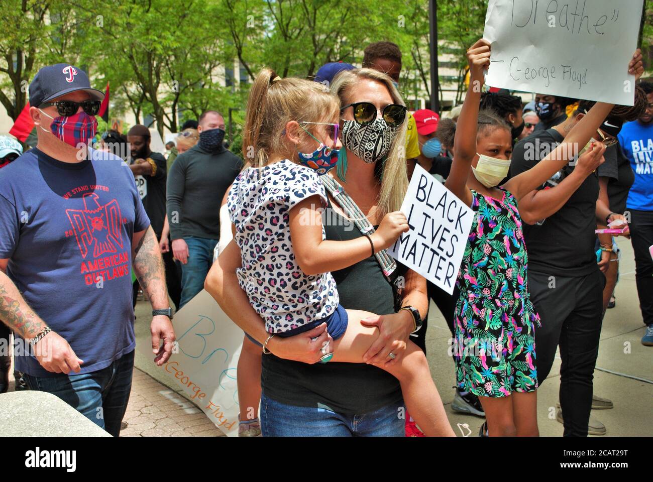 Dayton, Ohio, United States 05/30/2020 protesters at a black lives matter rally marching down the street holding signs and wearing masks Stock Photo
