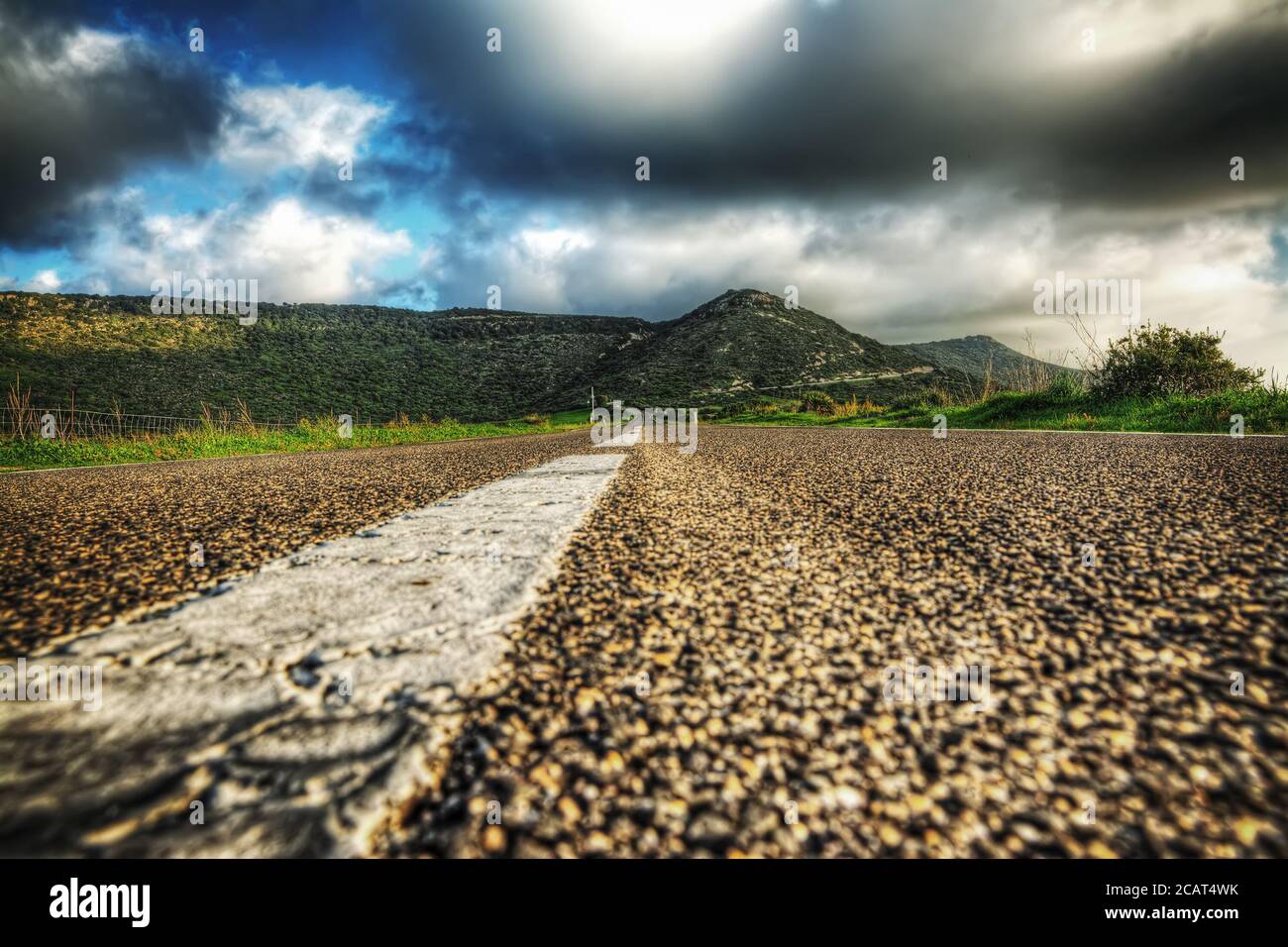 country road under a grey sky in hdr tone mapping effect Stock Photo - Alamy