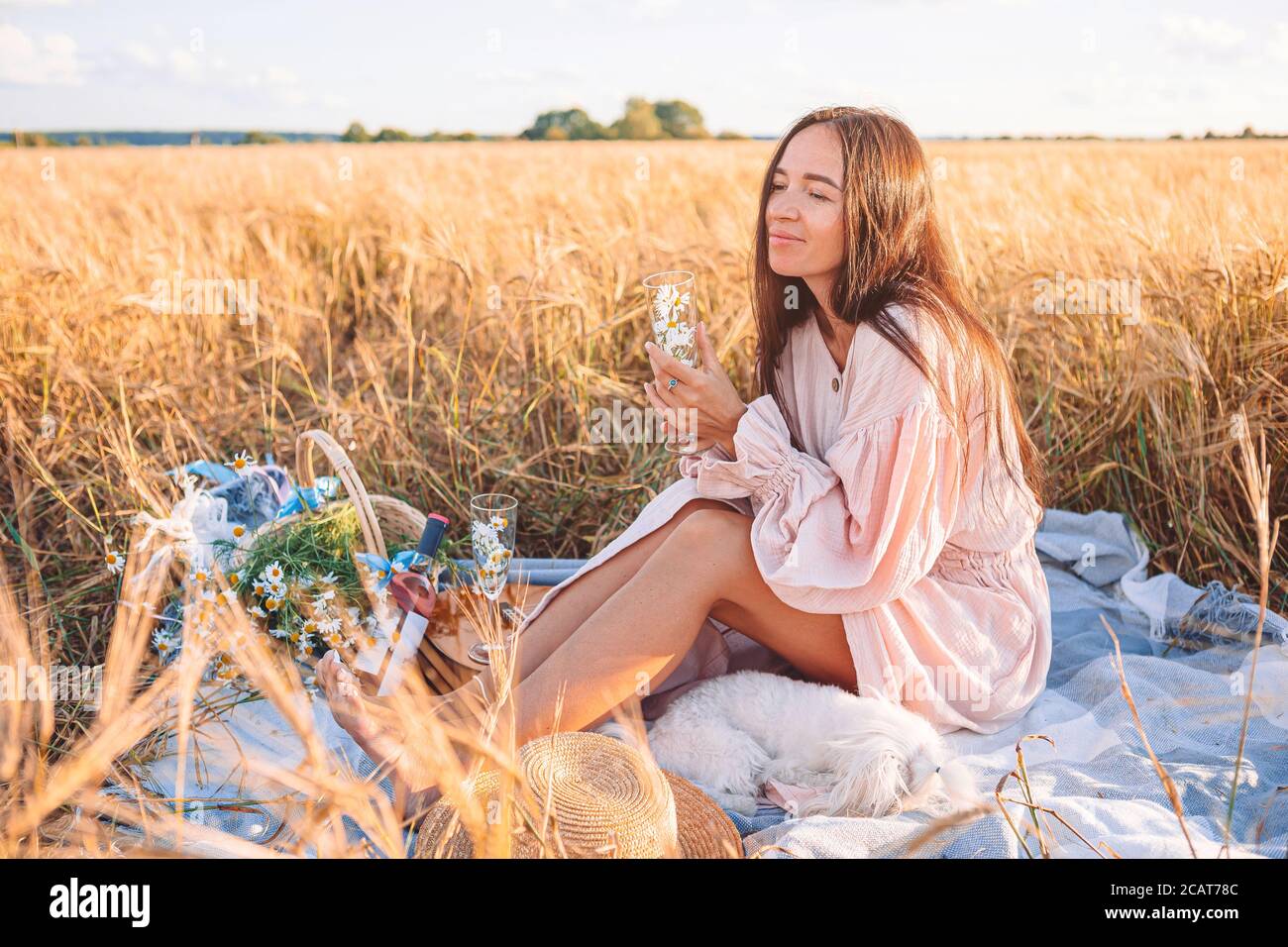 Beautiful girl in wheat field with ripe wheat in hands Stock Photo - Alamy