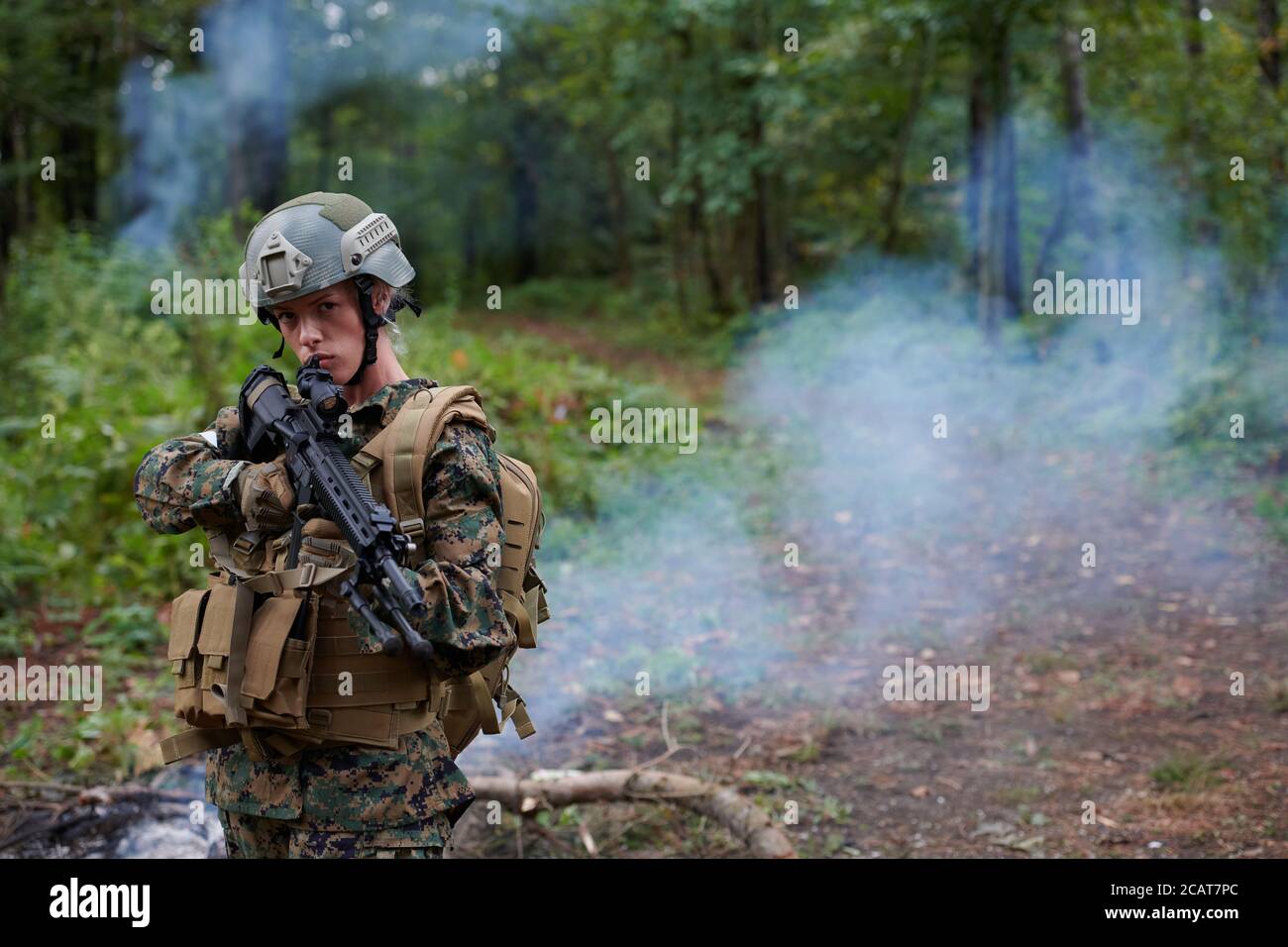 woman soldier ready for battle wearing protective military gear and