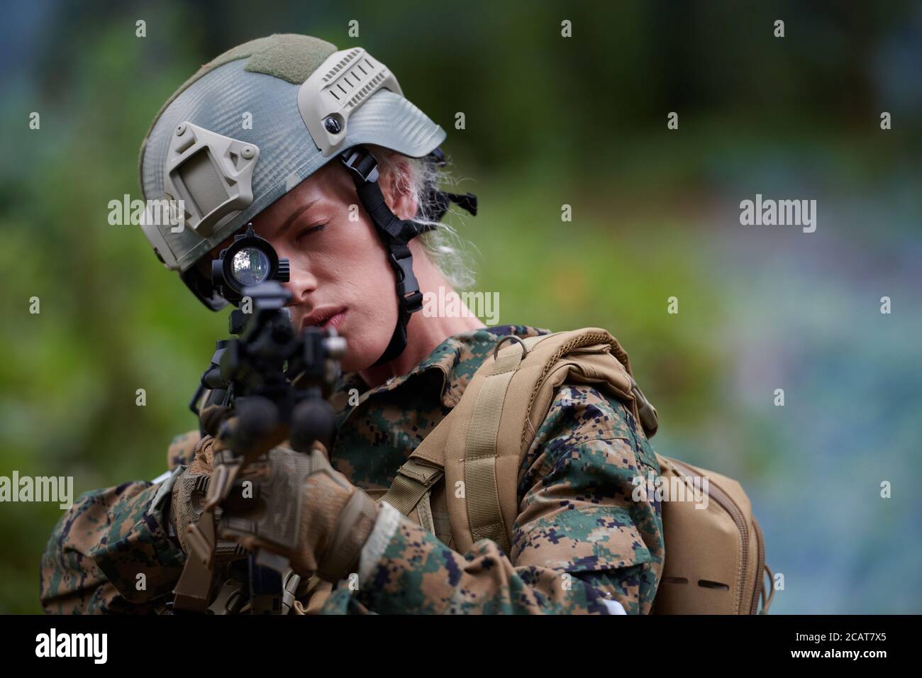 woman soldier ready for battle wearing protective military gear and