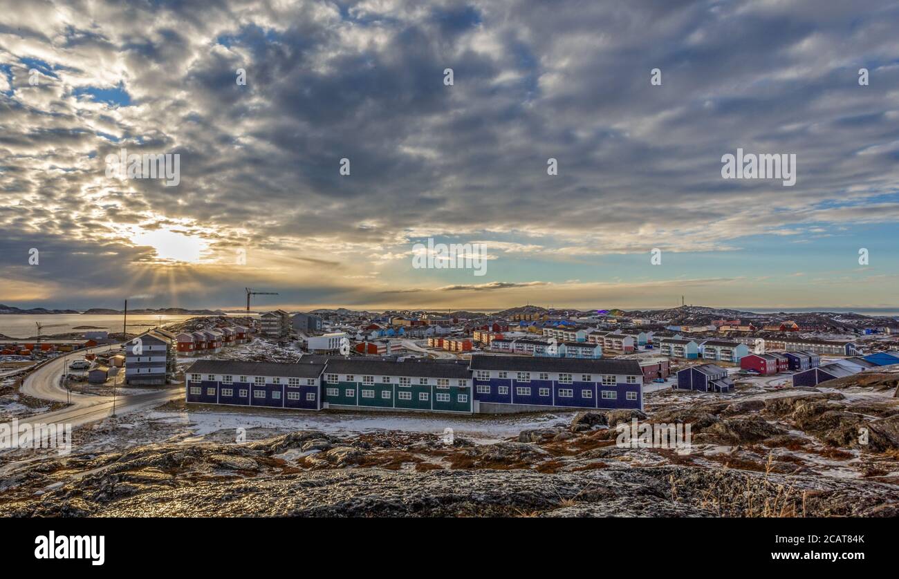 Grenlandic arctic city panorama with houses on the rocky hills in sunset city panorama. Nuuk, Greenland Stock Photo
