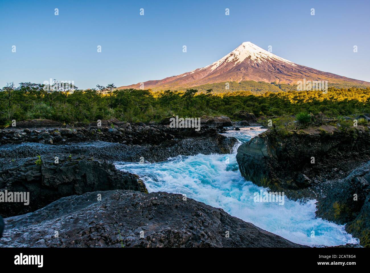 Osorno Volcano seen over Petrohue Waterfalls in Chile Stock Photo