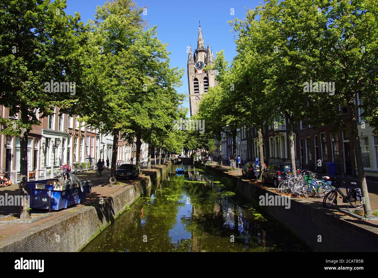 The Oude Delft canal and leaning tower of Gothic Protestant Oude Kerk in the picturesque Dutch historical cit Stock Photo