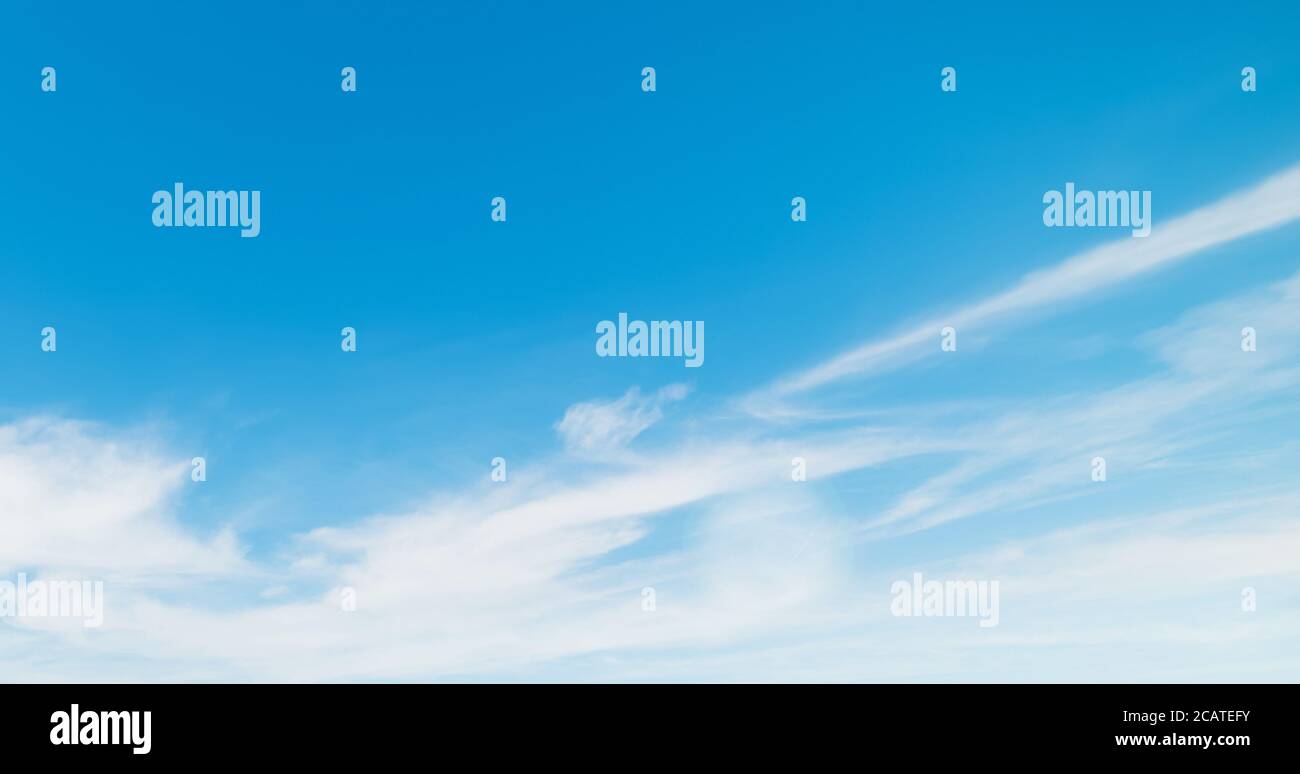 blue sky with white, soft clouds Stock Photo - Alamy