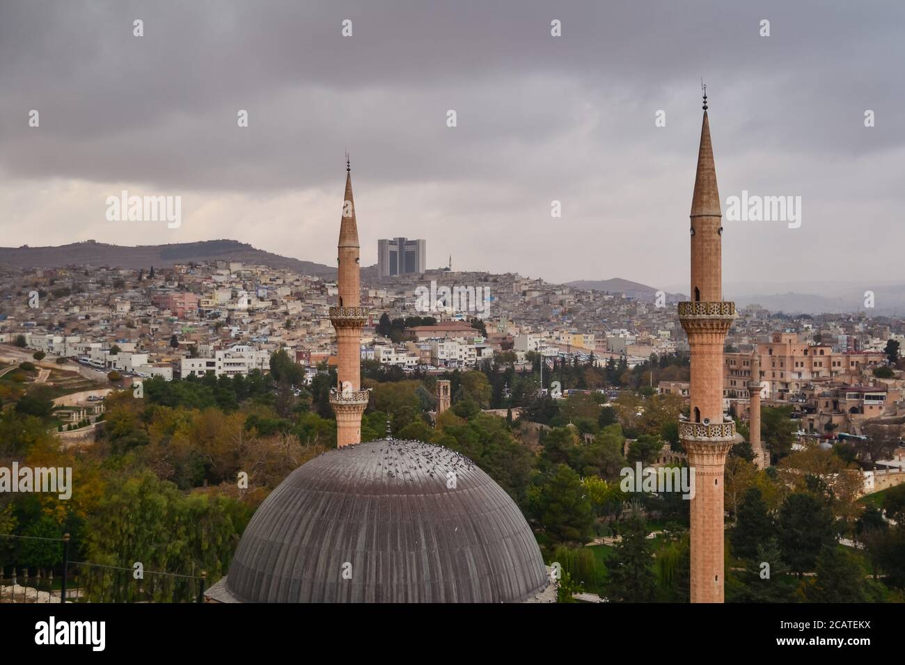 Dramatic panoramic city view from fort with Mevlid Halil Mosque minaret, Sanliurfa, Turkey Stock Photo