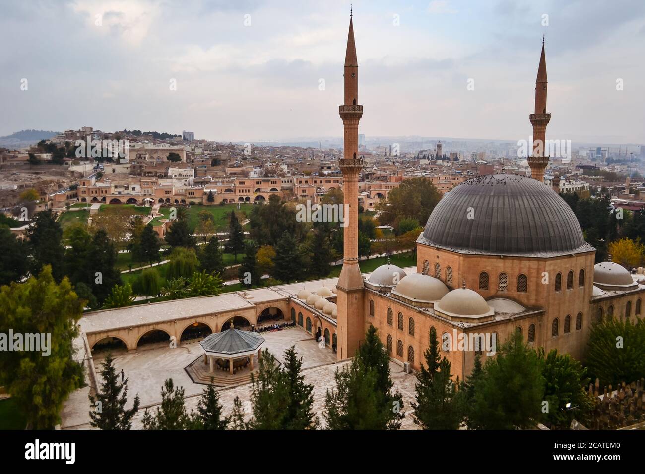 Dramatic panoramic city view from fort with Mevlid Halil Mosque minaret, Sanliurfa, Turkey Stock Photo