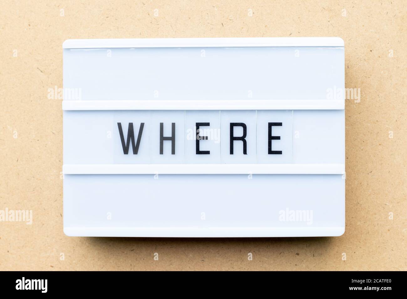 White lightbox with word where on wood background Stock Photo