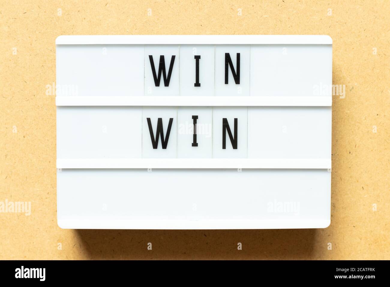Lightbox with word win win on wood background Stock Photo