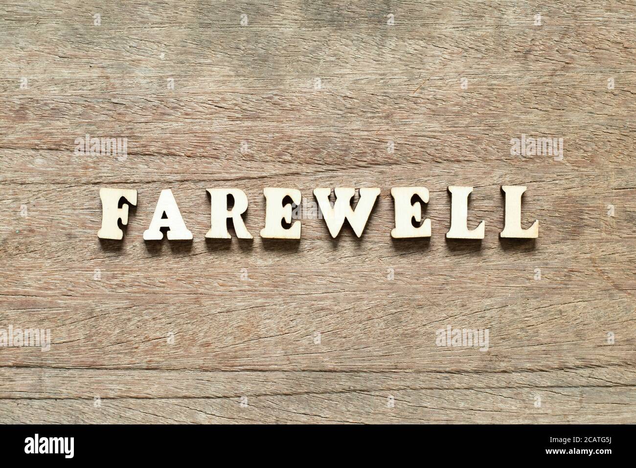 Alphabet letter block in word farewell on wood background Stock Photo