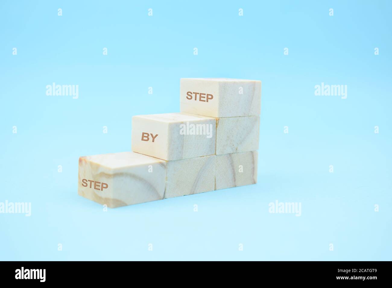 Step By Step to the top wooden cubes Stock Photo - Alamy