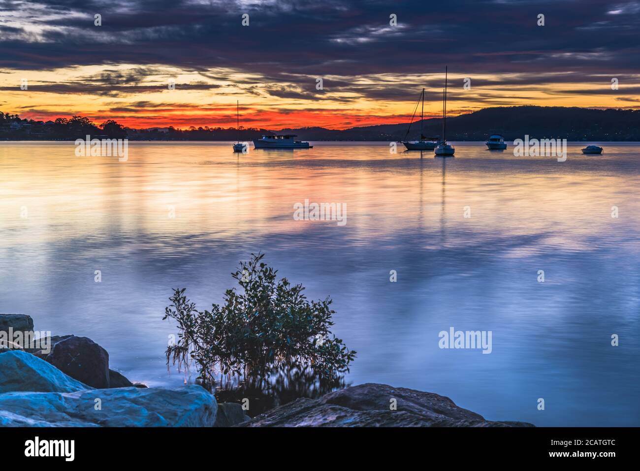 Colourful Clouds and Sunrise from Koolewong Waterfront on the Central Coast, NSW, Australia. Stock Photo