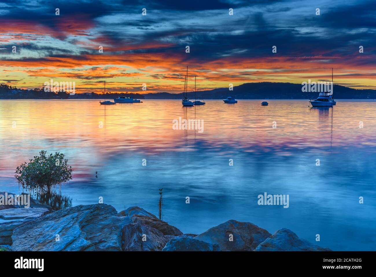 Colourful Clouds and Sunrise from Koolewong Waterfront on the Central Coast, NSW, Australia. Stock Photo