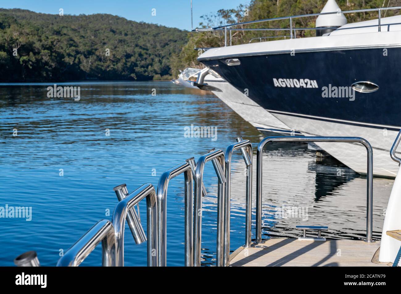 Fence on the back of the boat at Akuna Bay on a sunny winter afternoon Stock Photo
