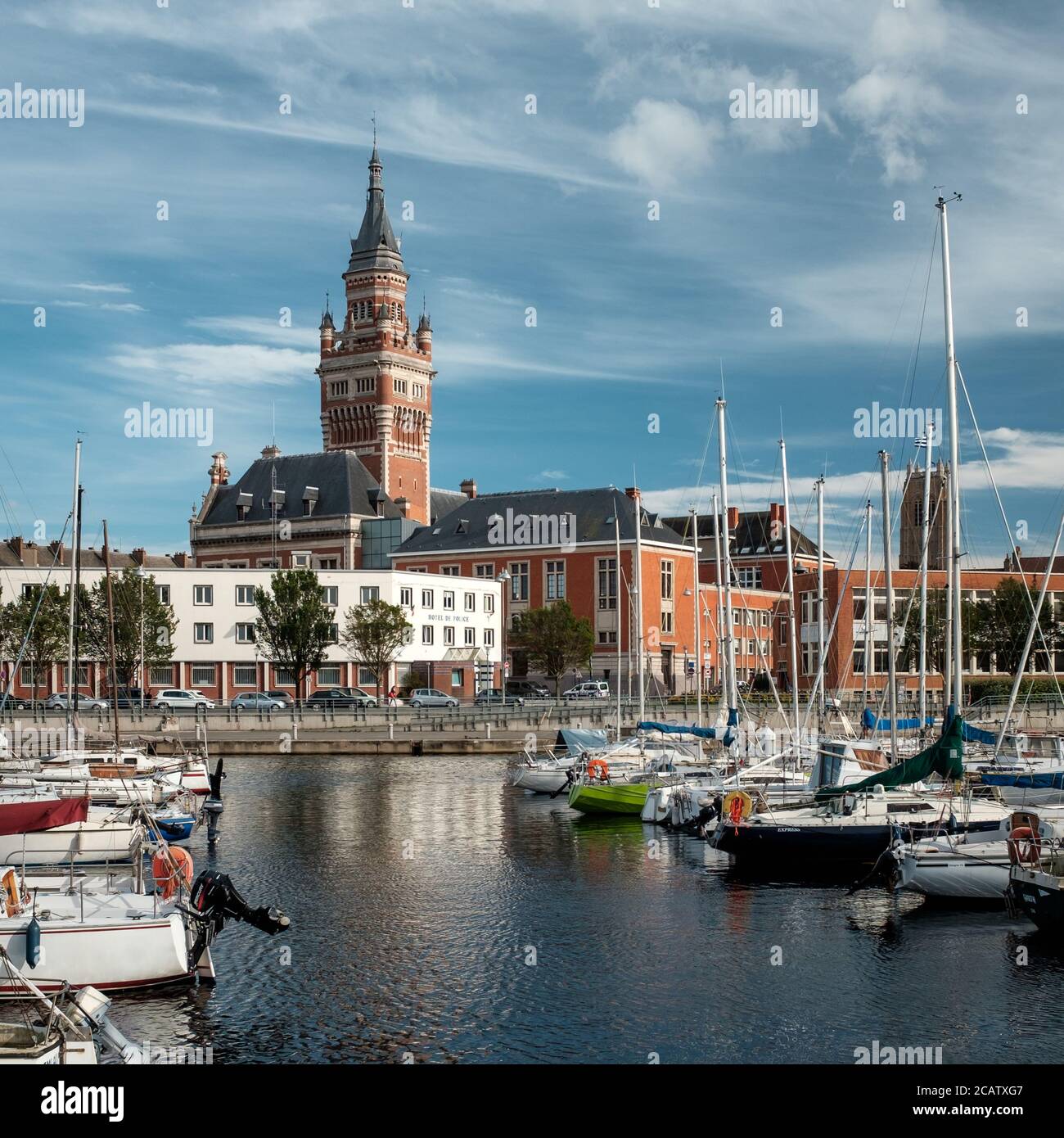 View on the town hall and bellfry from accross the marina called 'Bassin du Commerce' Stock Photo