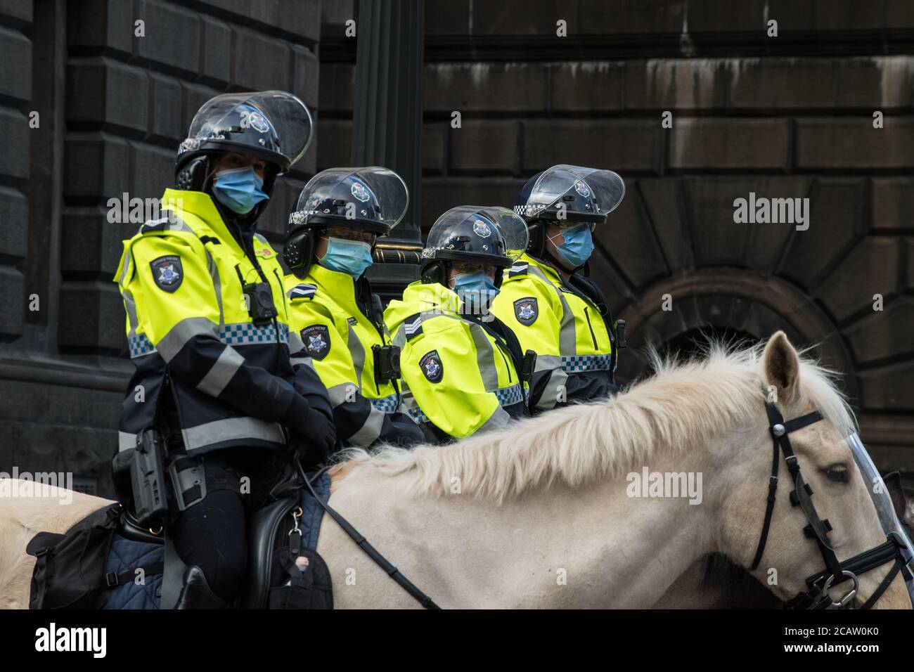 Melbourne, Australia 9 August 2020, Victoria Police Mounted Officers wait masked outside of the State Parliament where an anti-mask protest was planned for this morning. Credit: Michael Currie/Alamy Live News Stock Photo