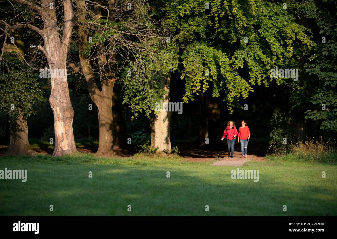 Stockport, UK. 9th Aug, 2020. Two women take an early morning walk as temperatures are expected to reach above 30 degrees centigrade in parts of the UK. Credit: Russell Hart/Alamy Live News Stock Photo