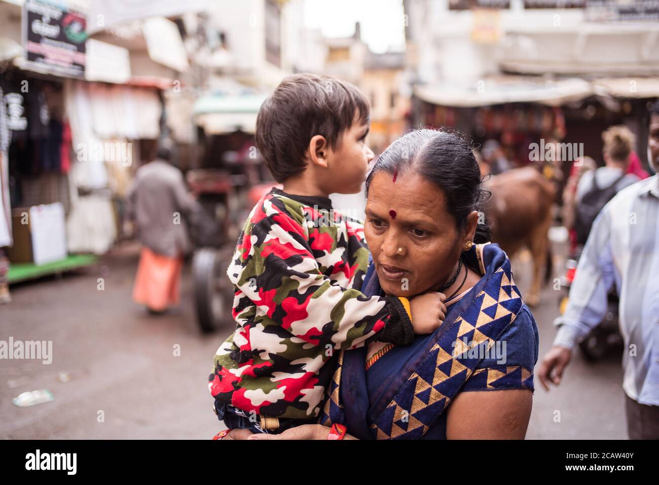 Indian woman holding baby hi-res stock photography and images - Alamy