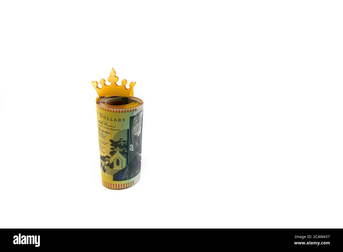 Stack of Australian 50 dollars banknotes with golden crown isolated over white background with copy space, cash is king concept image Stock Photo