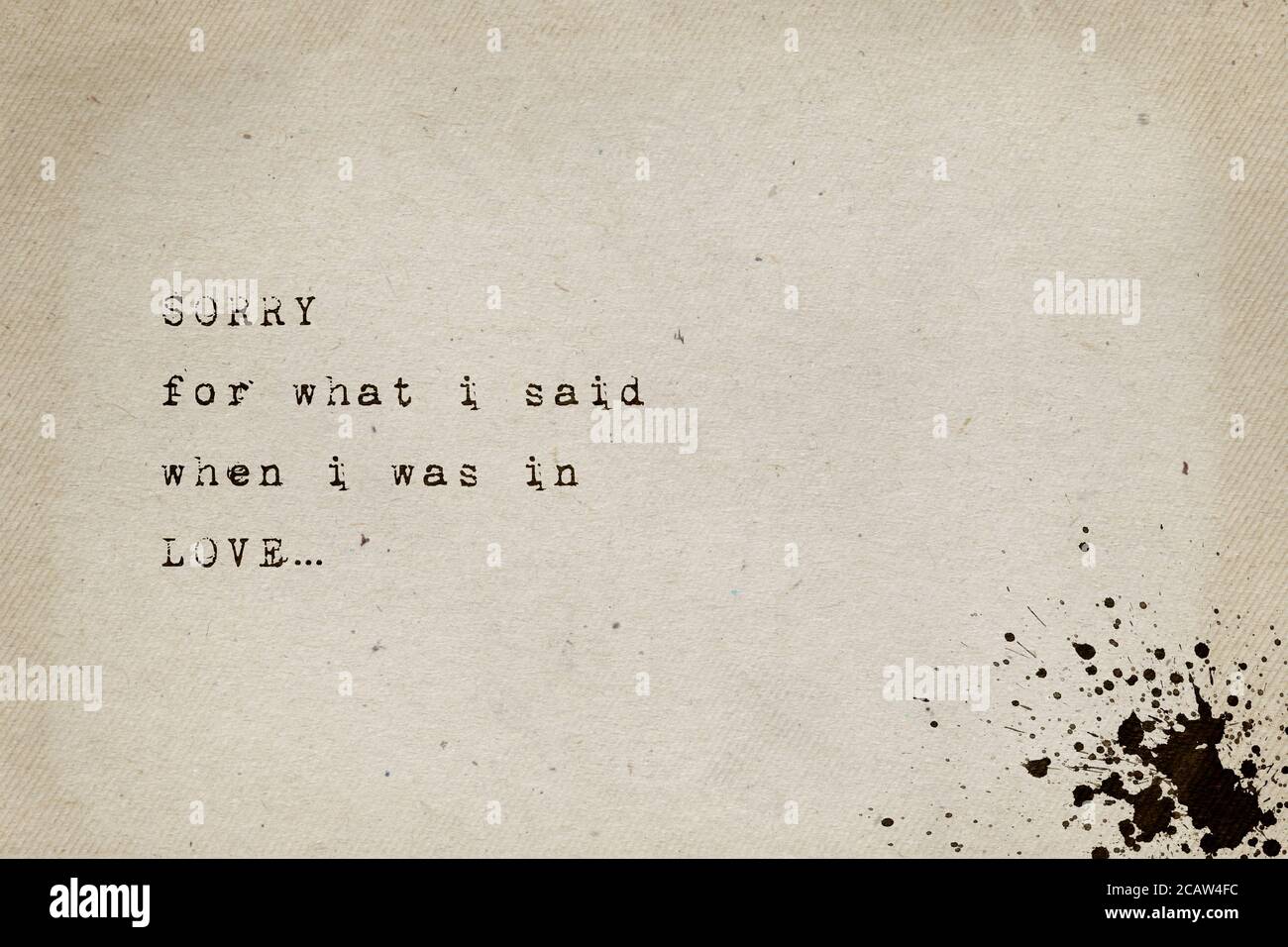 Sorry for what i said when i was in love. Minimalist text art, conceptual illustration, typewriter font style written on old paper texture. Life drama Stock Photo