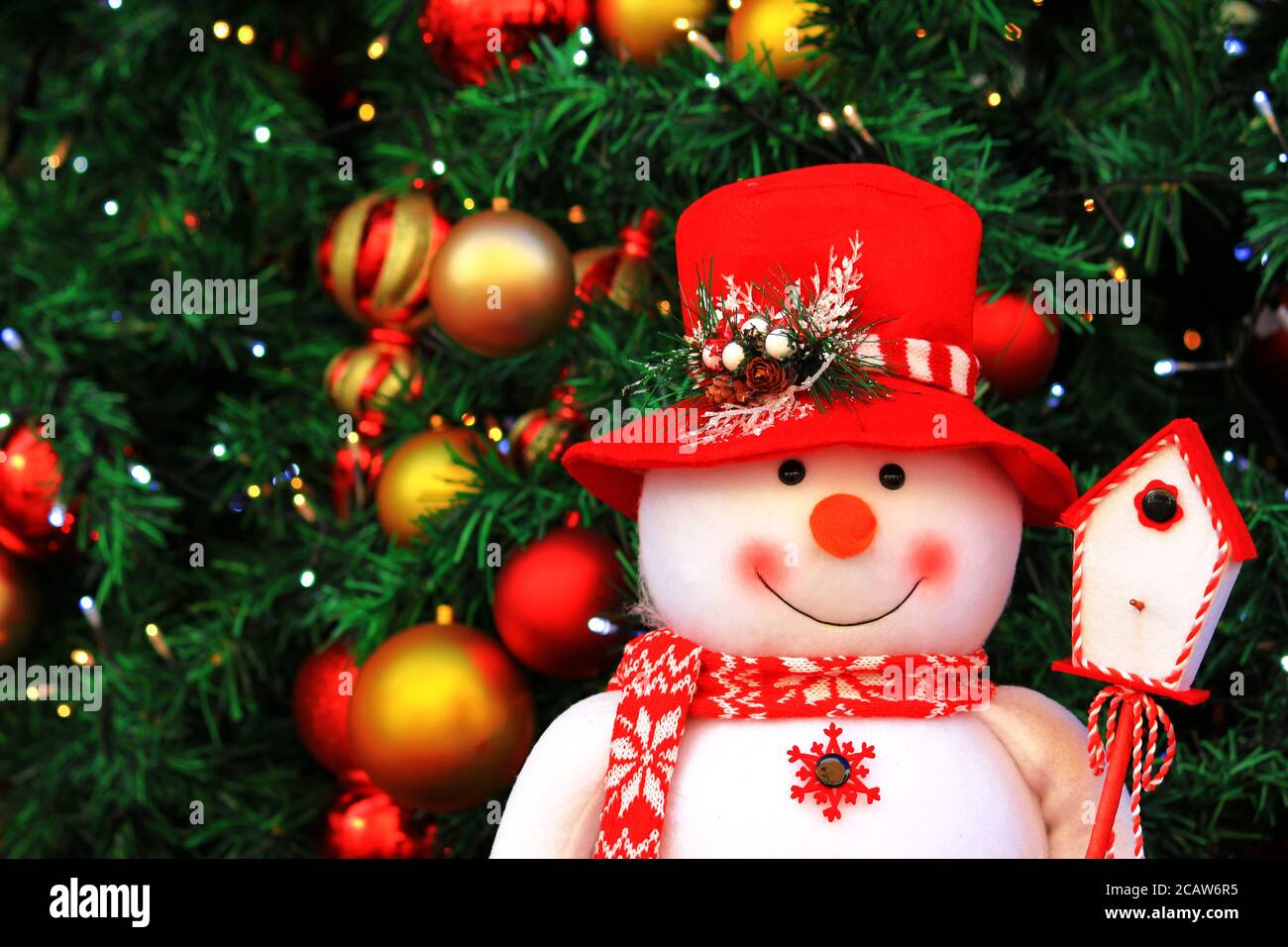 Christmas tree and cute snowman doll Stock Photo