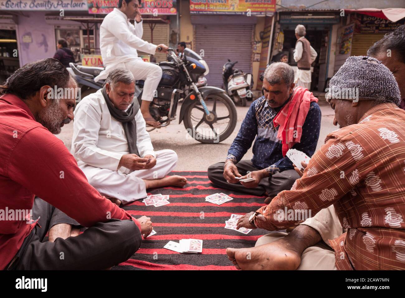 Pushkar / India - March 10, 2020: group of men playing cards on carpet on  the street floor in Pushkar Stock Photo - Alamy