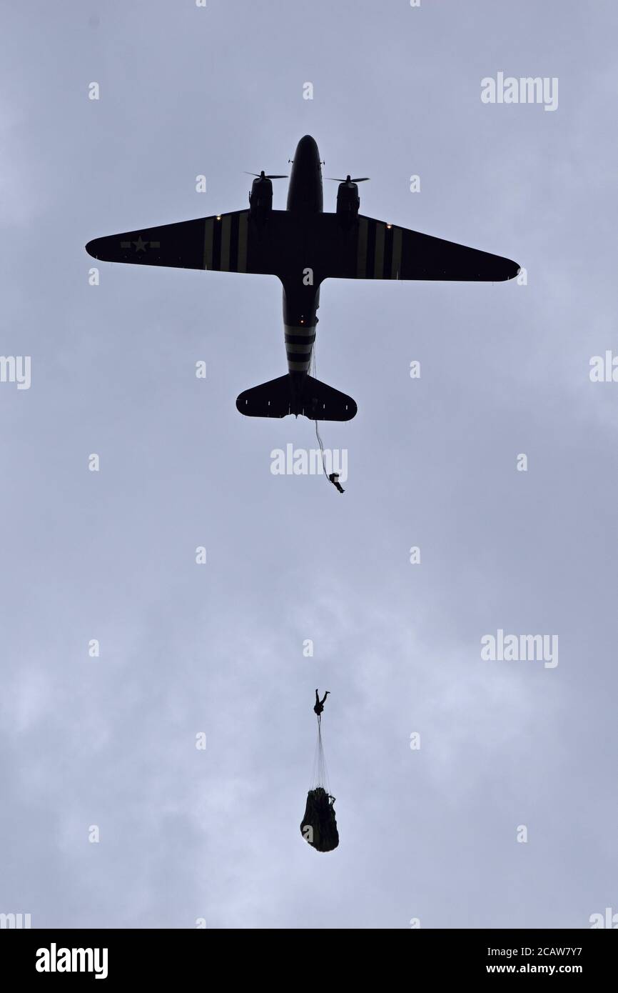 Dome parachute drop from Douglas aircraft as part of the D day 100 commemorations, Sonnerville, France Stock Photo