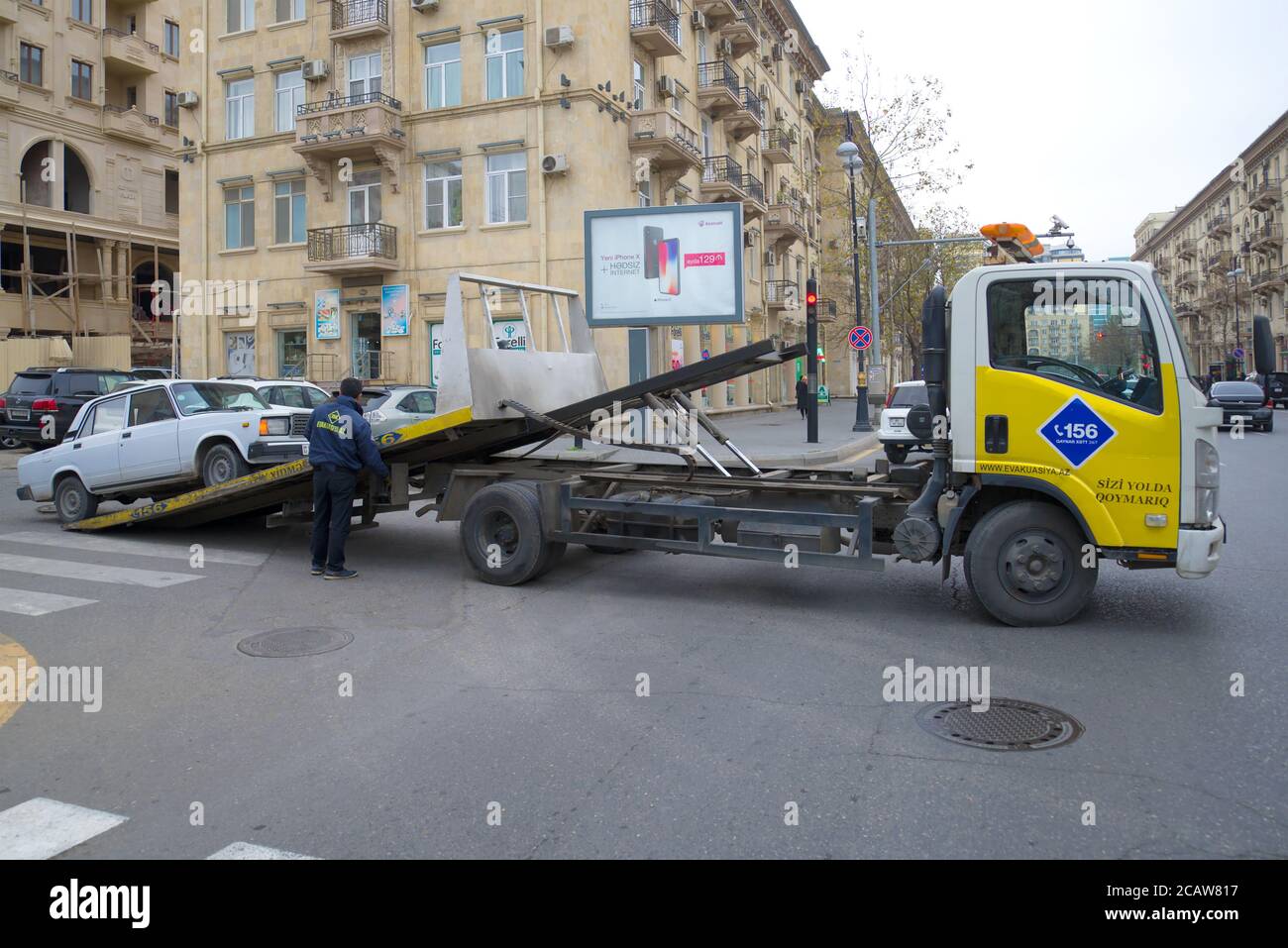 BAKU, AZERBAIJAN - JANUARY 05, 2018: Evacuation of a broken car VAZ-2107 on a city street Stock Photo
