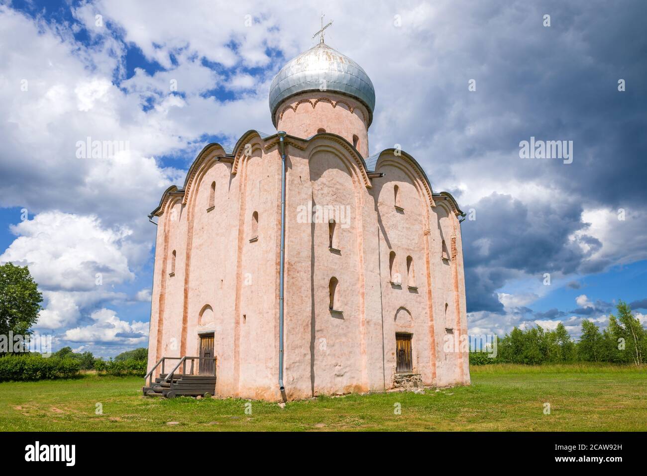 The ancient Church of the Savior on Nereditsa close-up under a cloudy sky. Surroundings of Veliky Novgorod, Russia Stock Photo