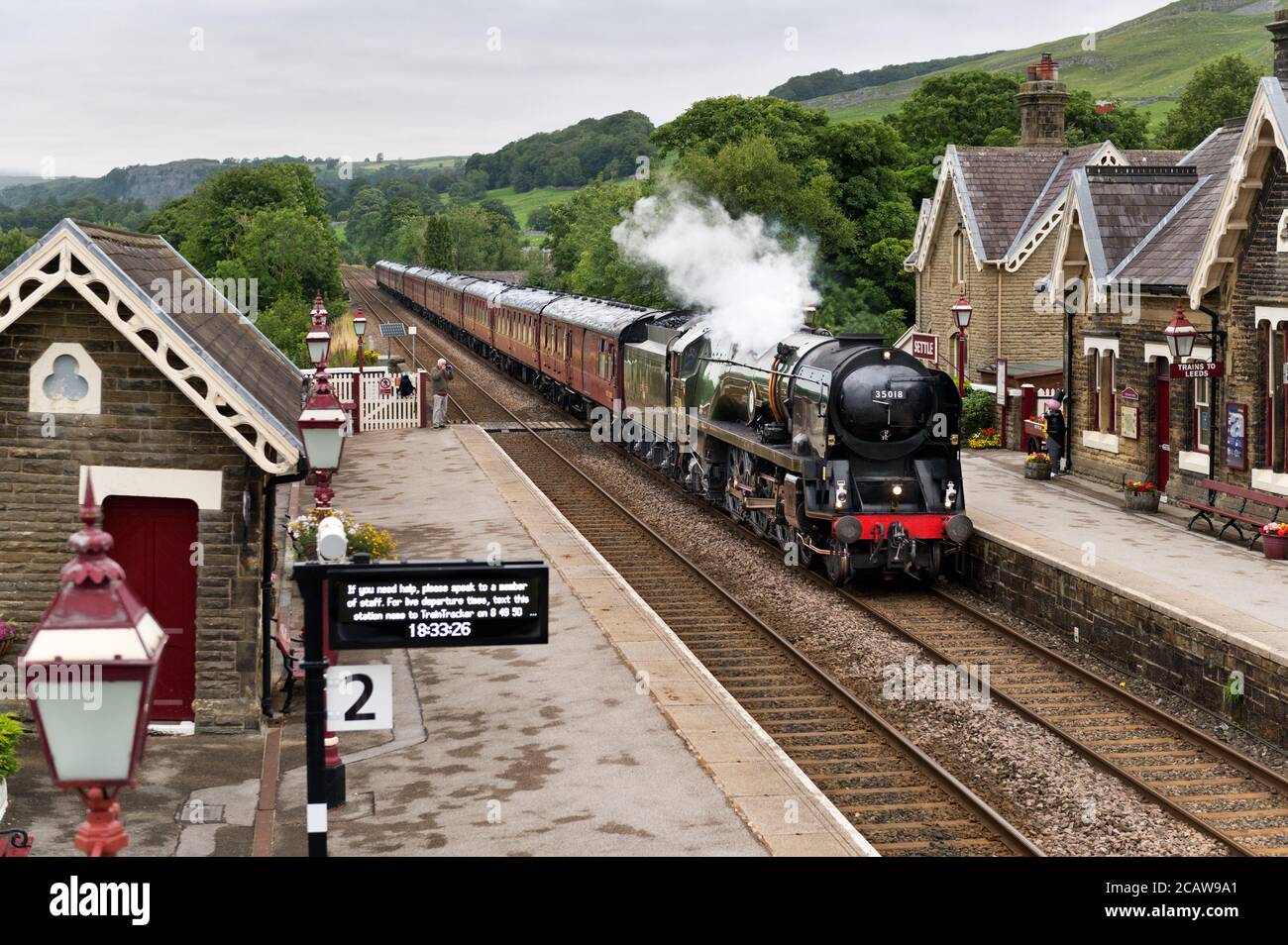 'The Dalesman' steam special heading south through Settle Station on the Settle-Carlisle railway line, 4th August 2020. Loco is 'British India Line'. Stock Photo