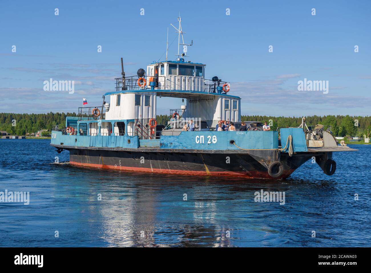 VOZNESENIE, RUSSIA - JUNE 13, 2020: Car and passenger ferry SP-28 on the Svir river close up on a sunny June day Stock Photo