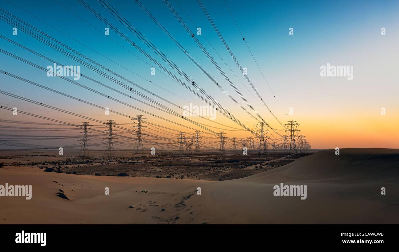 High voltage electric tower on sunrise time near Al Hofuf - Saudi Arabia. Stock Photo