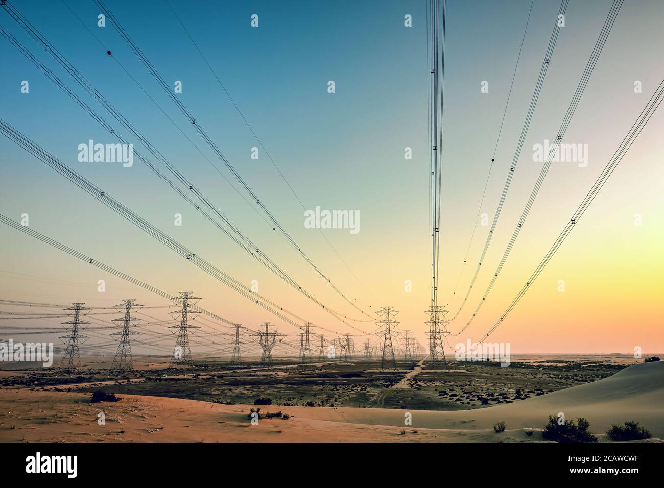 High voltage electric tower on sunrise time near Al Hofuf -Saudi Arabia. Stock Photo