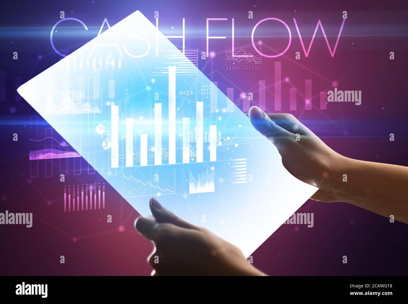 Hand holding futuristic tablet with CASH FLOW inscription above, modern ...
