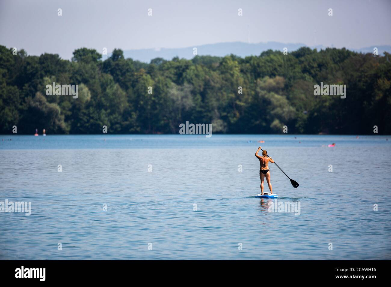 Freiburg, Germany. 09th Aug, 2020. A woman is riding on a Stand Up