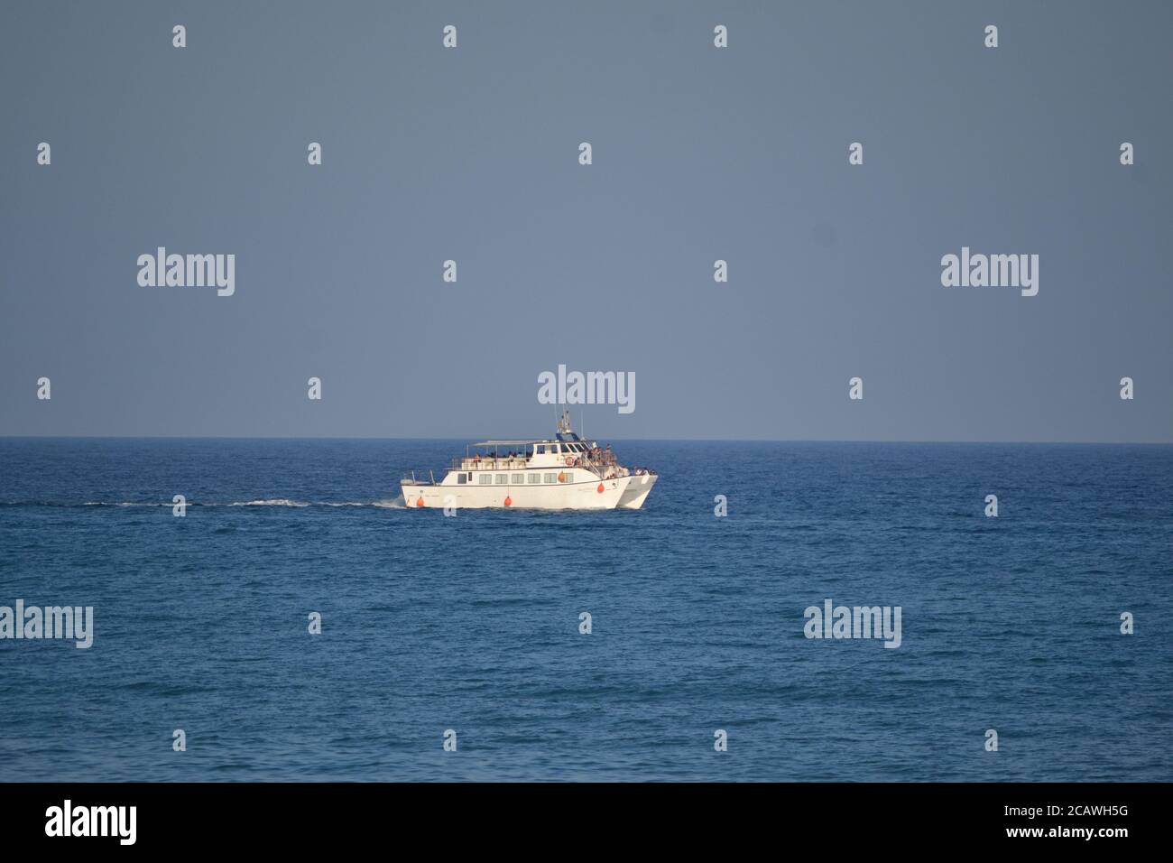 Motor boat sailing through the Mediterranean Sea, next to Oropesa del Mar, in Castelln, Spain. Stock Photo