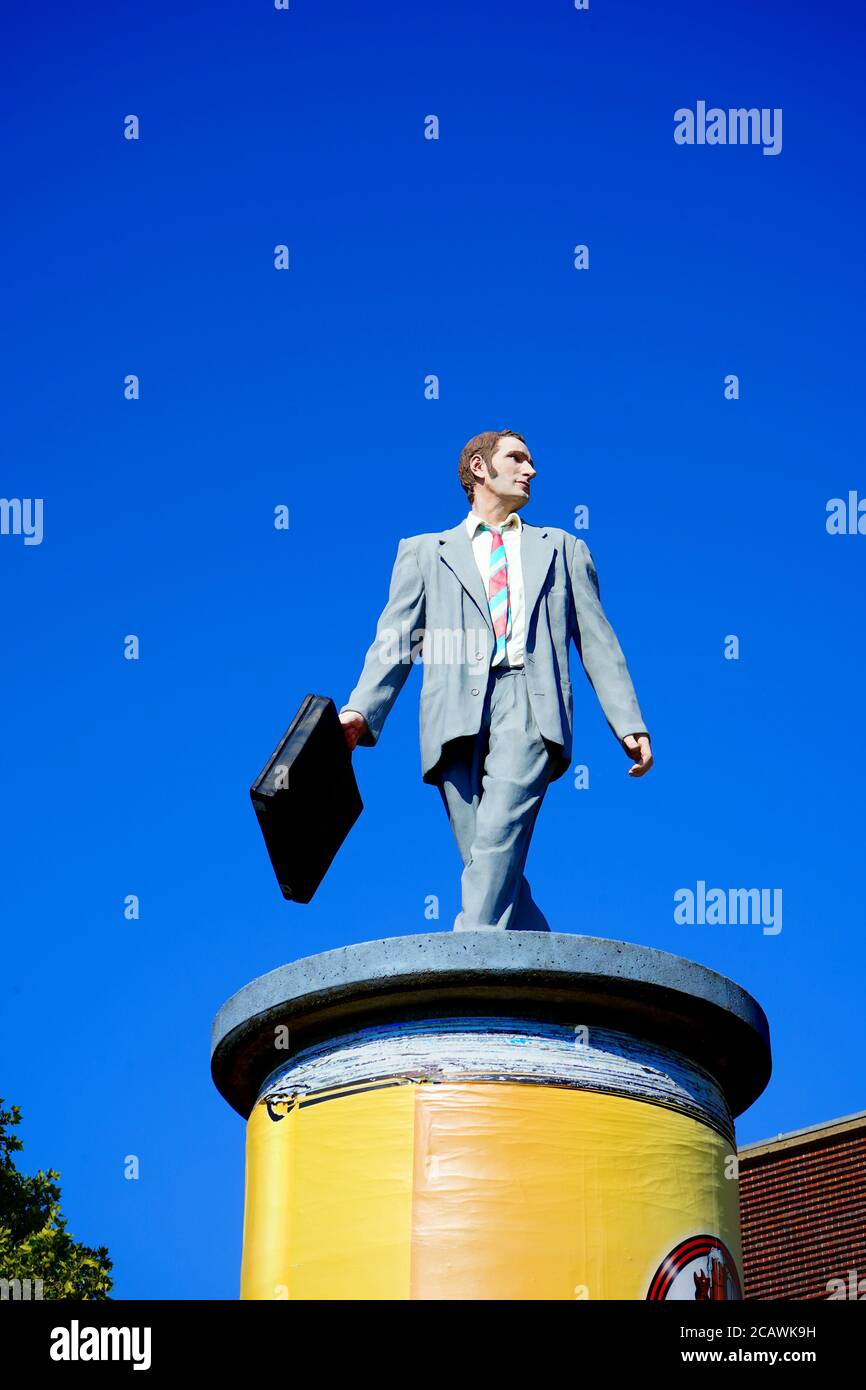 The modern art sculpture 'Geschäftsmann' / 'Businessman' by Christoph Pöggeler. It belongs to the art project 'Säulenheilige', depicting normal people. Stock Photo