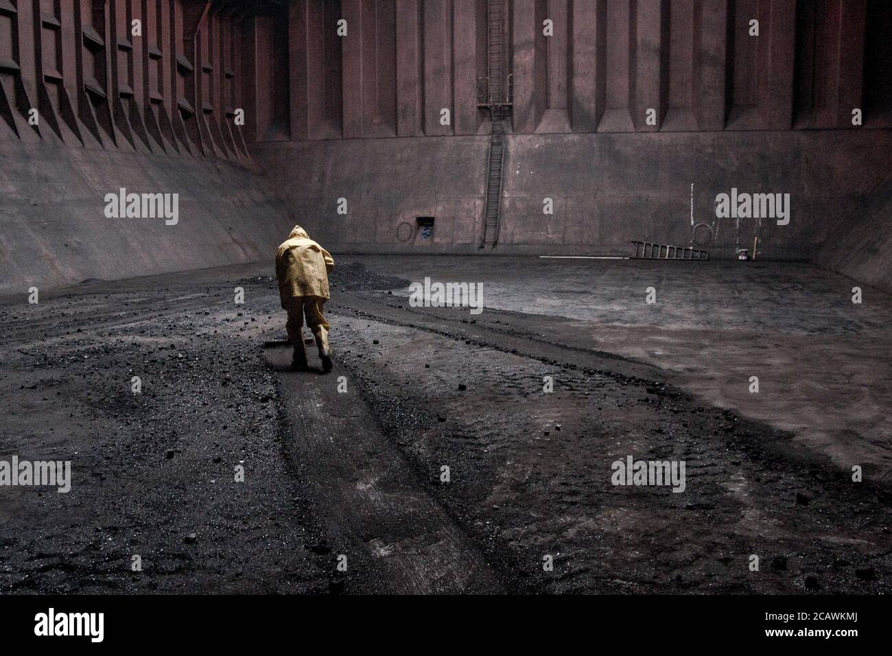 Seaman cleaning cargo hold on ship Stock Photo Alamy