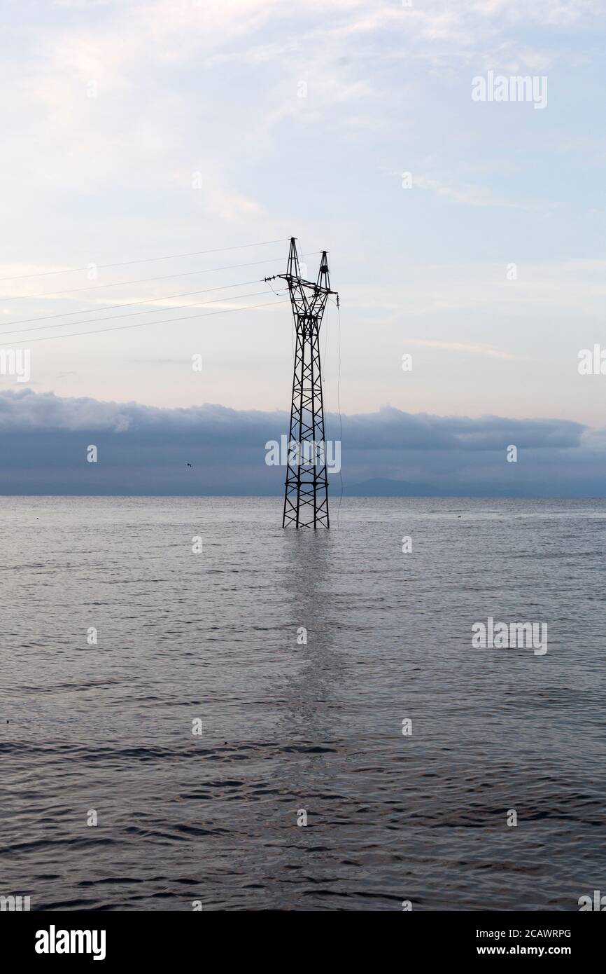 Electric pylon flooded by Lake Sevan Stock Photo