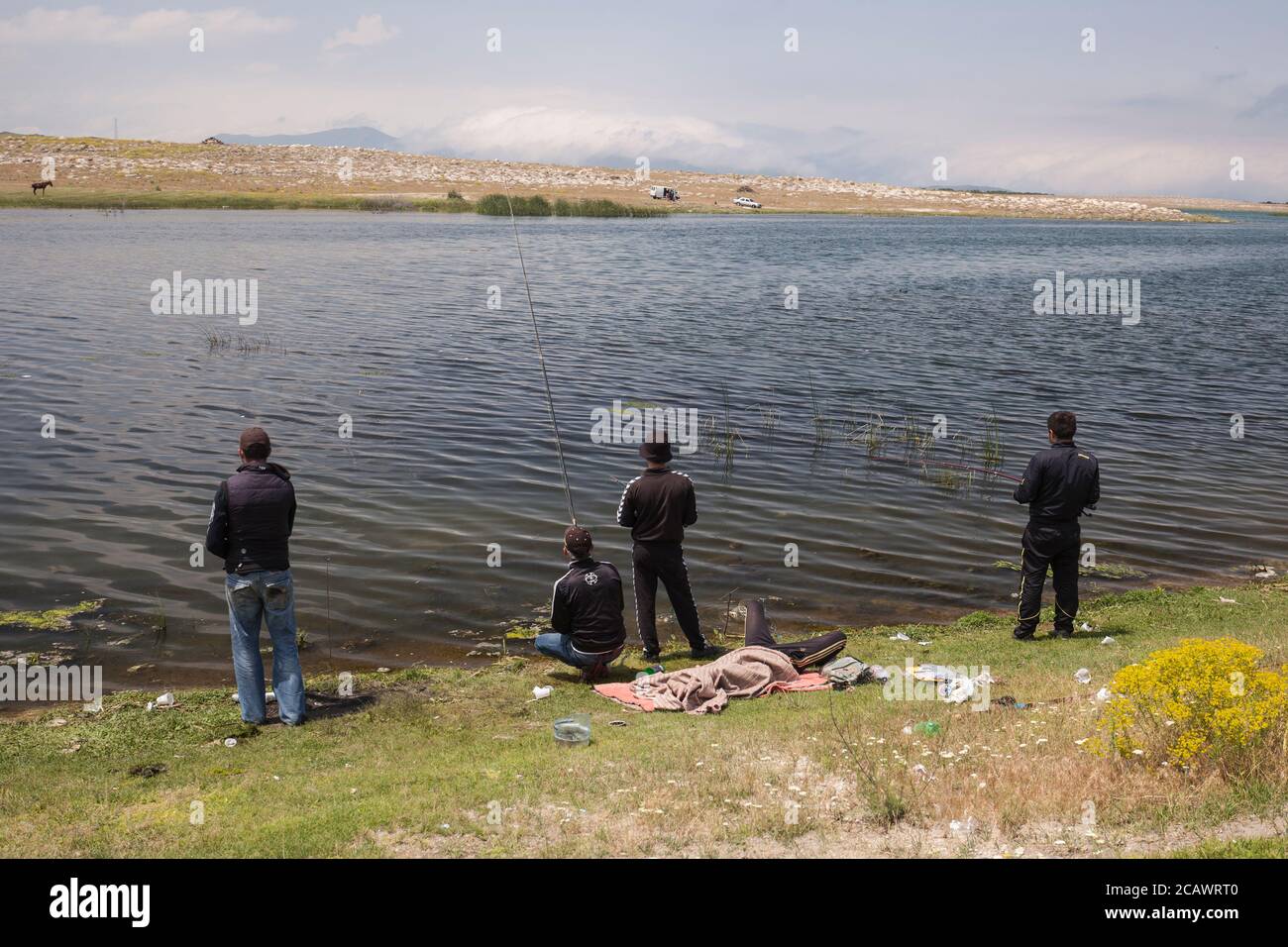 Men fishing in Lake Sevan, Armenia Stock Photo