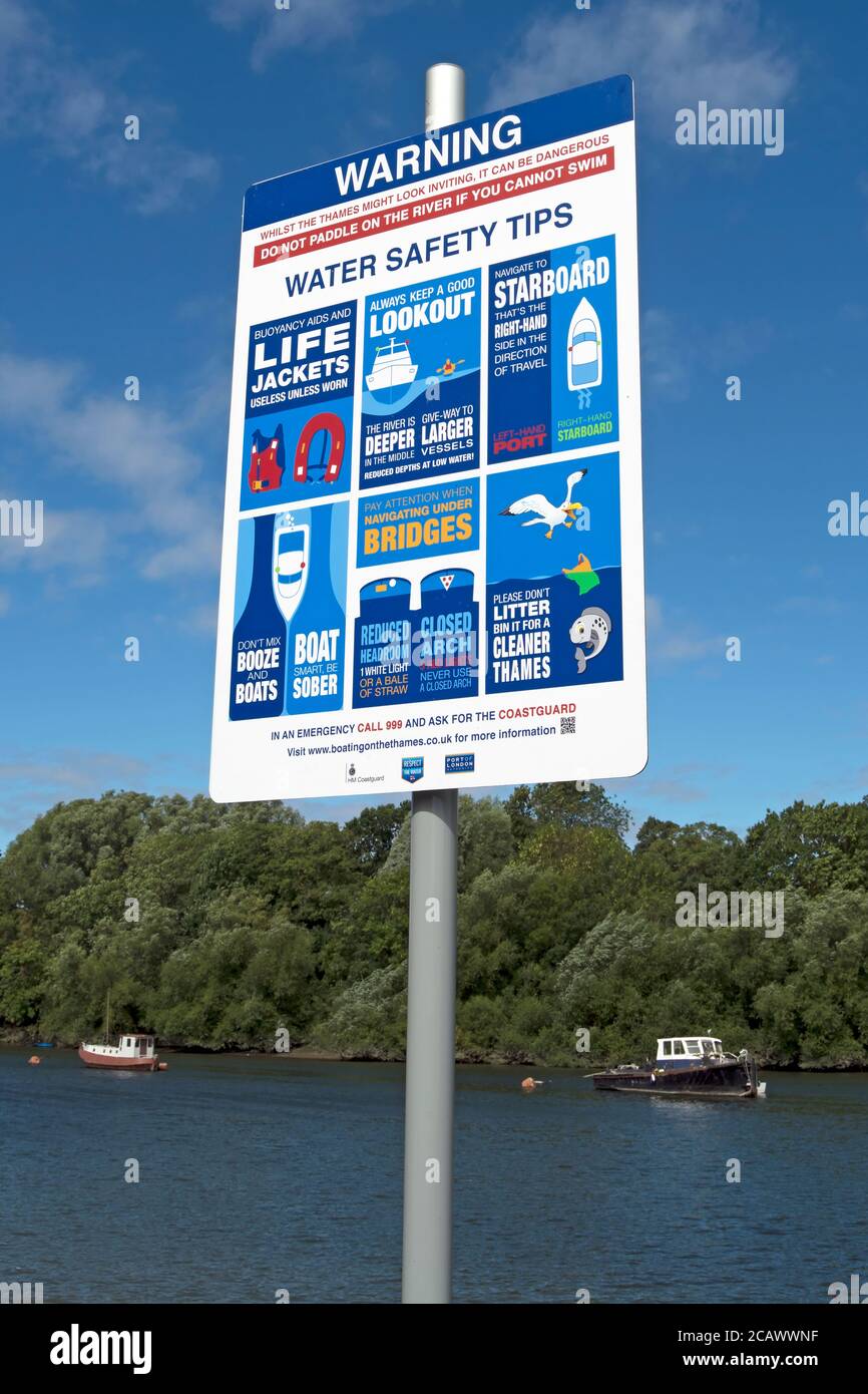 warning sign beside the river thames at ham, surrey, england, giving water safety tips Stock Photo