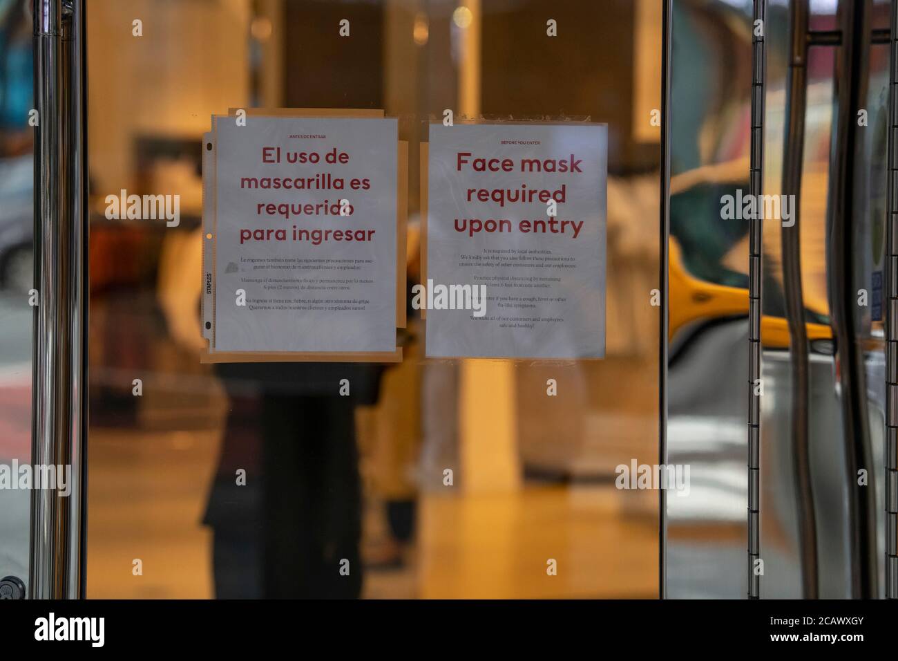 August 08, 2020: A face mask required sign sits on the front of H&M in Times Square in Manhattan, New York. Mandatory credit: Kostas Lymperopoulos/CSM Stock Photo