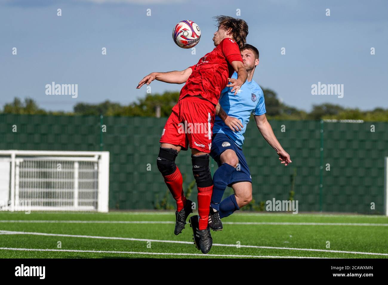 Players competing for a header at a football match at Aveley FC Parkside  stadium in August 2020 as matches resume after COVID-19 lockdown. Heading  Stock Photo - Alamy