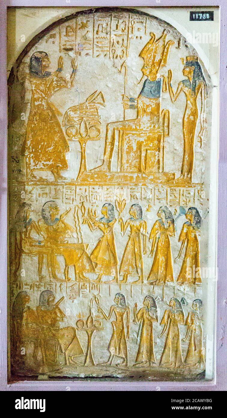 Egypt, Cairo, Egyptian Museum, stele of Paheripezet, Abydos. Praying Osiris and Isis, offering a libation to the couple. Stock Photo